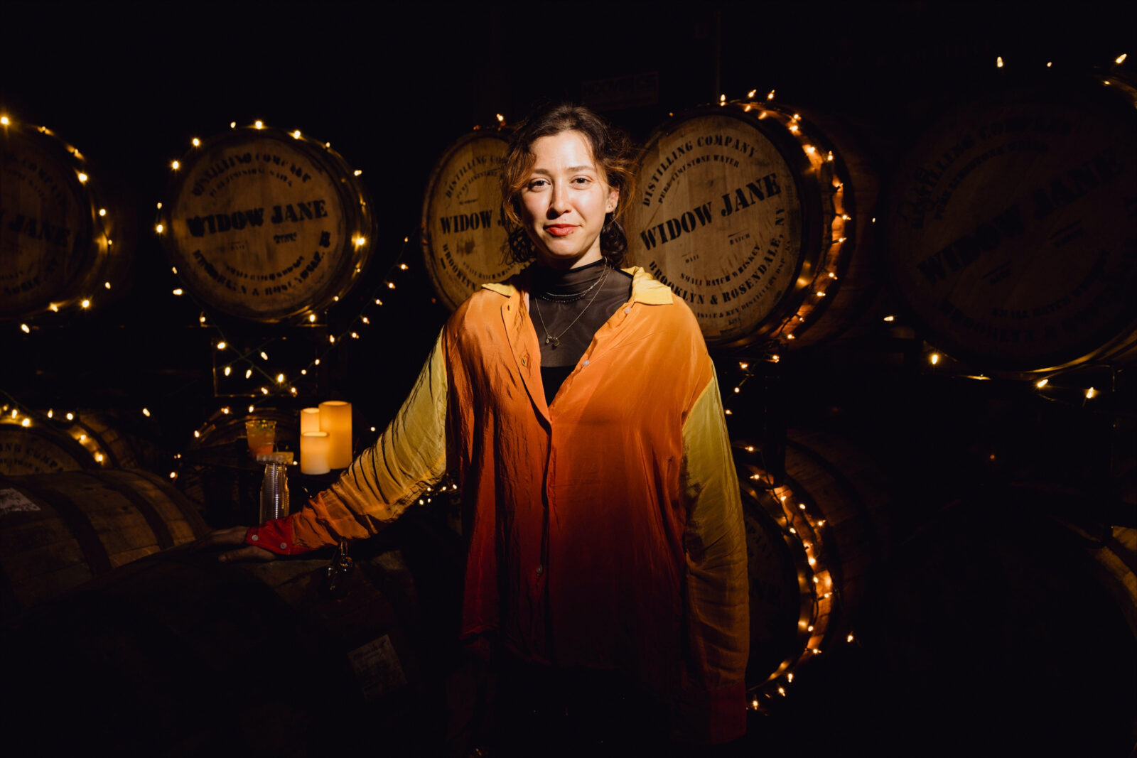 A woman in a distillery