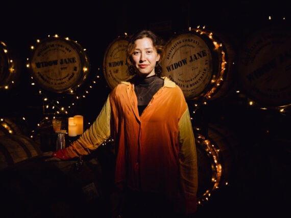 A woman in a distillery