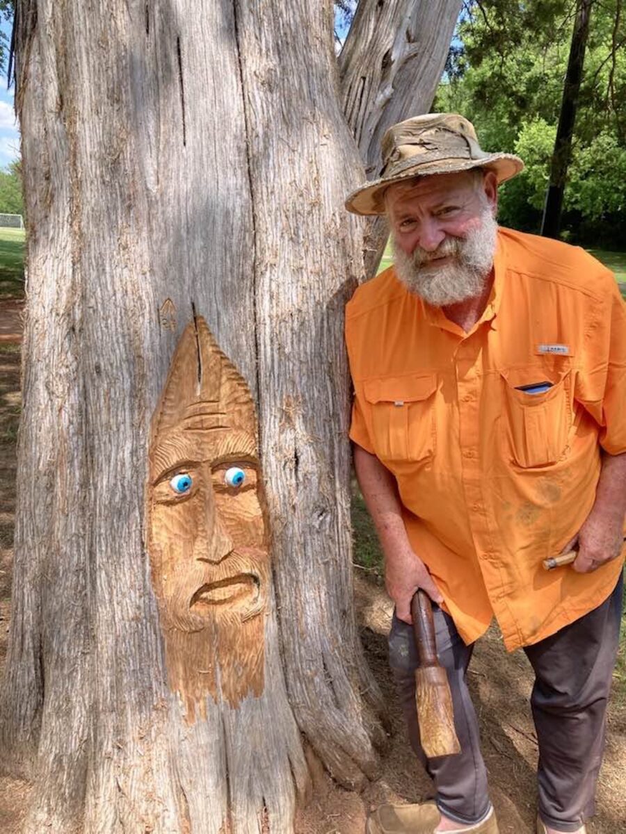 A man with a wood carving