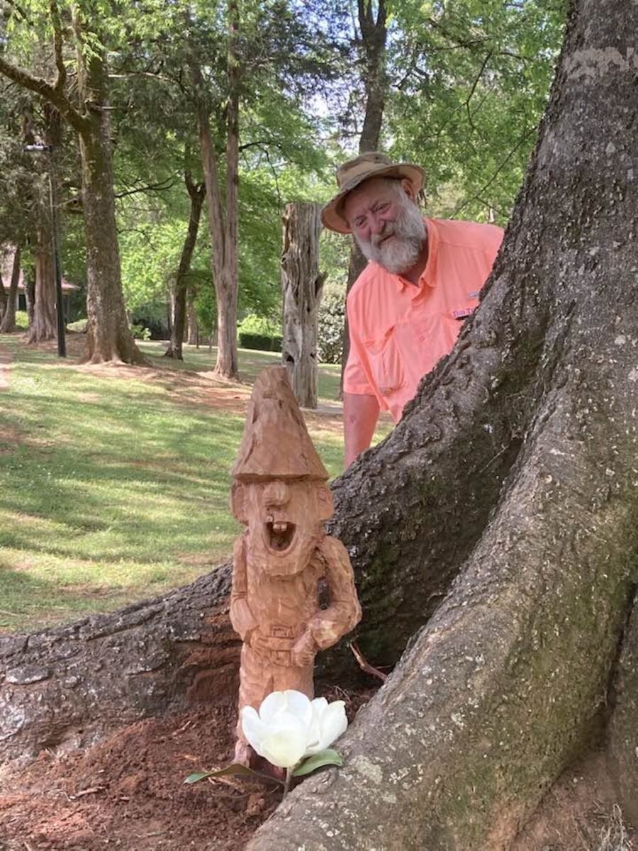 A man with a wood gnome