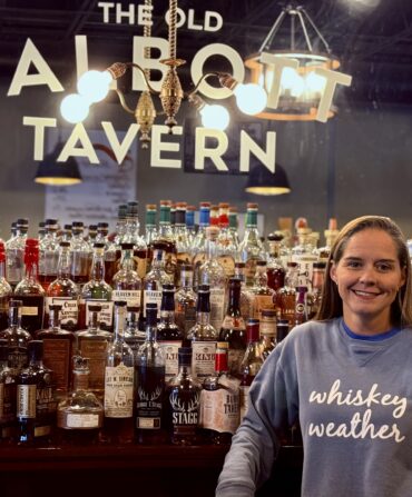 A woman in front of a bar