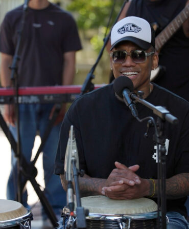 A man sitting at a drum set