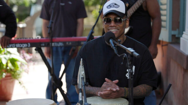 A man sitting at a drum set
