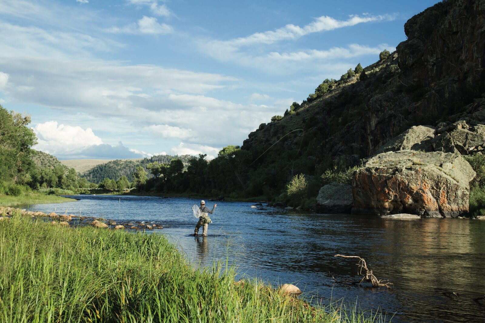 A man fishes on the water