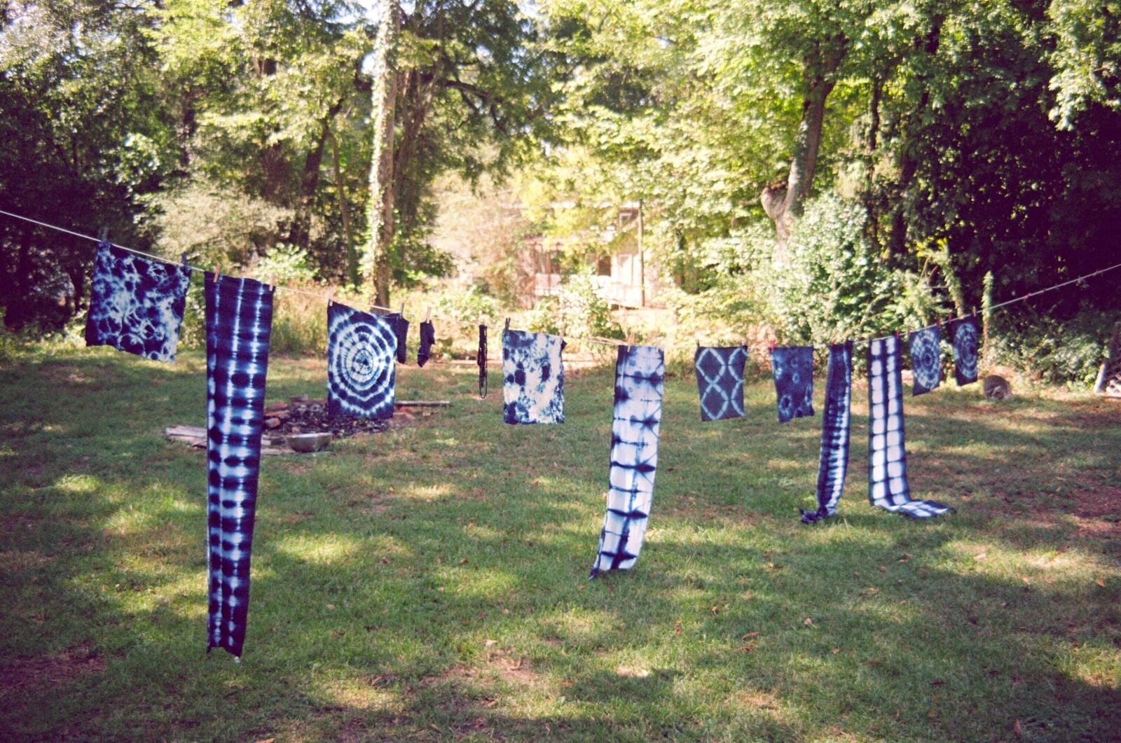 Indigo-dyed fabric hangs on a line