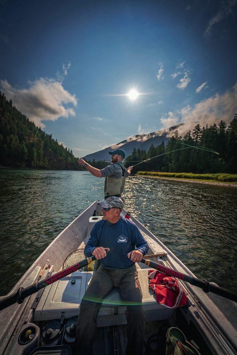 Two men in a fishing boat on a river