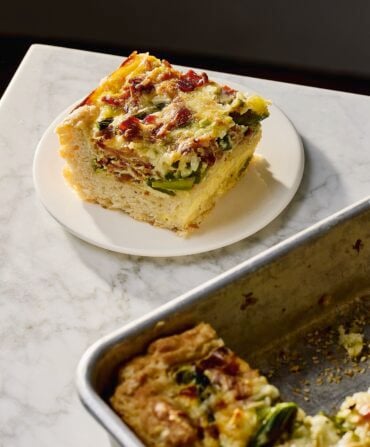 A slab of quiche on a plate