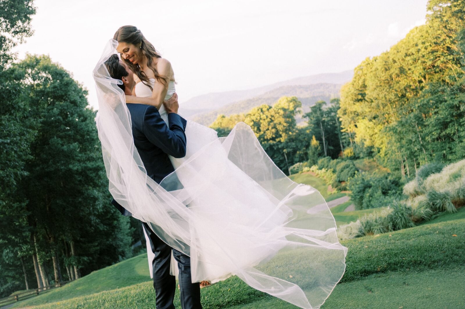 a bride and groom embrace