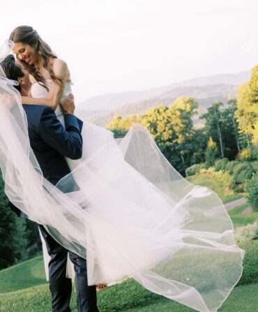 a bride and groom embrace