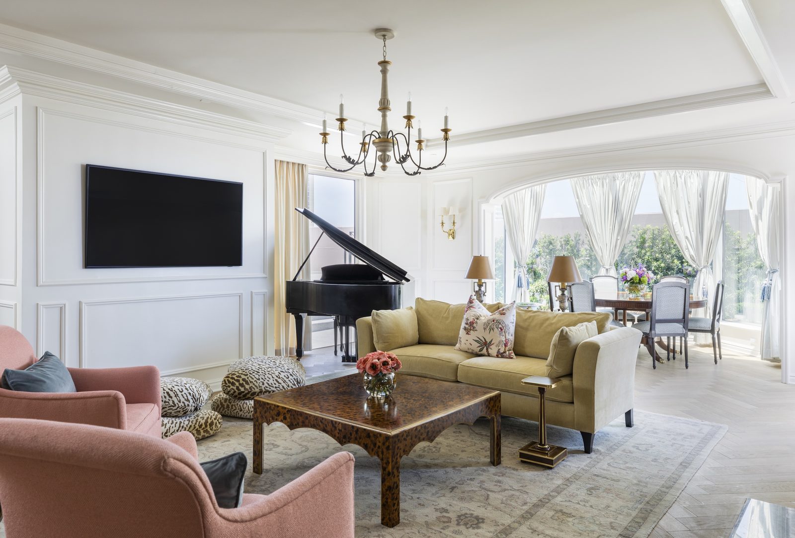 a living room with grand piano