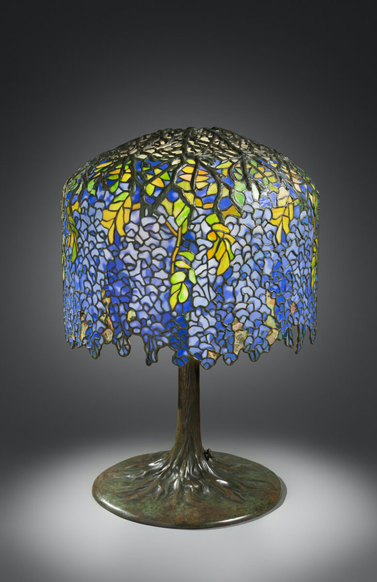 A Tiffany lamp with tree-like imagery